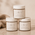 Skincare products on a wooden surface with a warm, neutral background